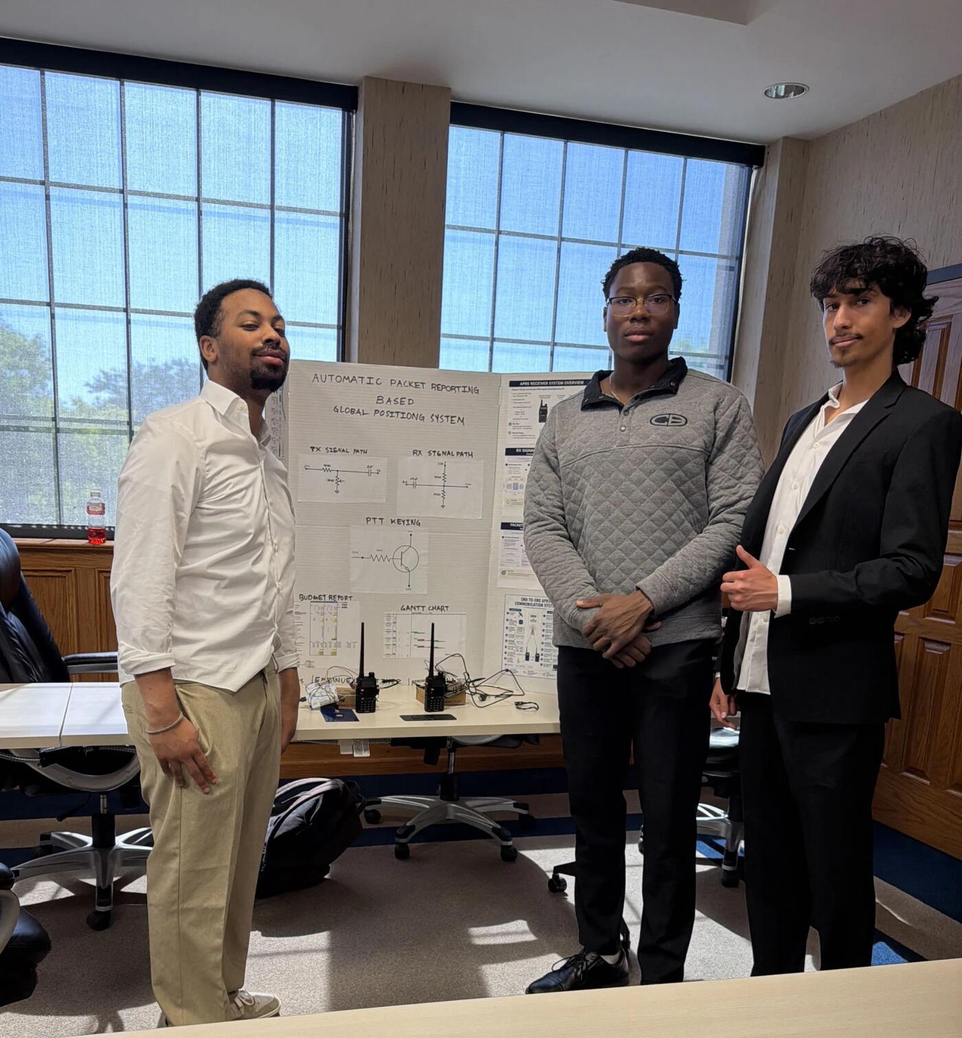 The team presenting the APRS tracking system