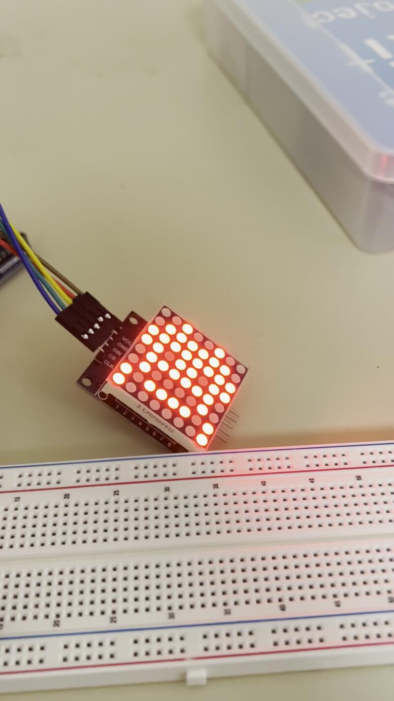 The LED dot matrix showing a pixel art sprite