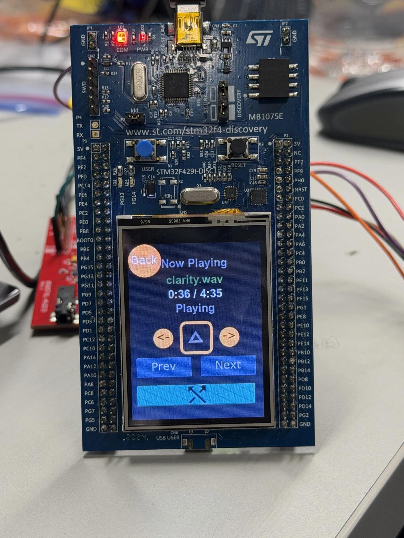The Discovery board running the player, mid song on the touchscreen